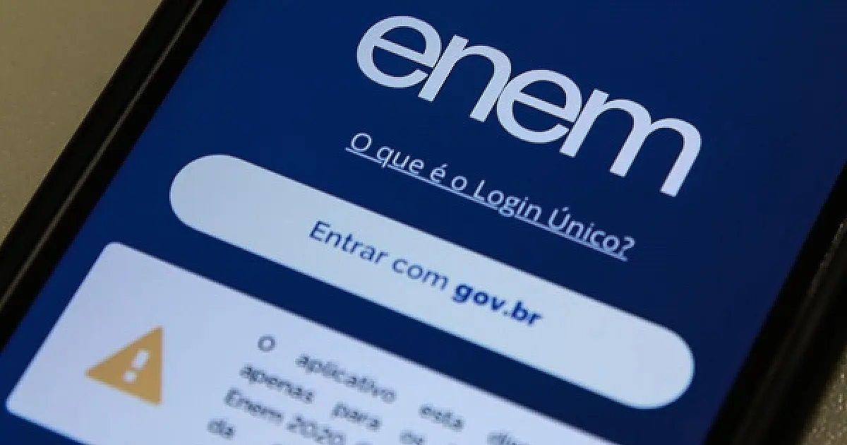 Celular com a tela azul do aplicativo do Enem e o botão «Entrar com gov.br»